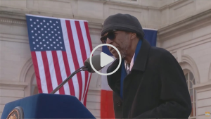 Screenshot of a YouTube video titled " Cave Canem Co-founder Cornelius Eady Delivers Powerful Poem at Zohran Mamdani's Inauguration."