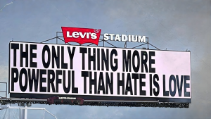 A billboard with the line, The only thing more powerful than hate is love.