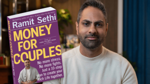 Ramit Sethi pictured next to his "Money for Couples" workbook.