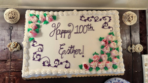 Joy’s mother, Esther Rowland, smiling at her 100th birthday celebration.